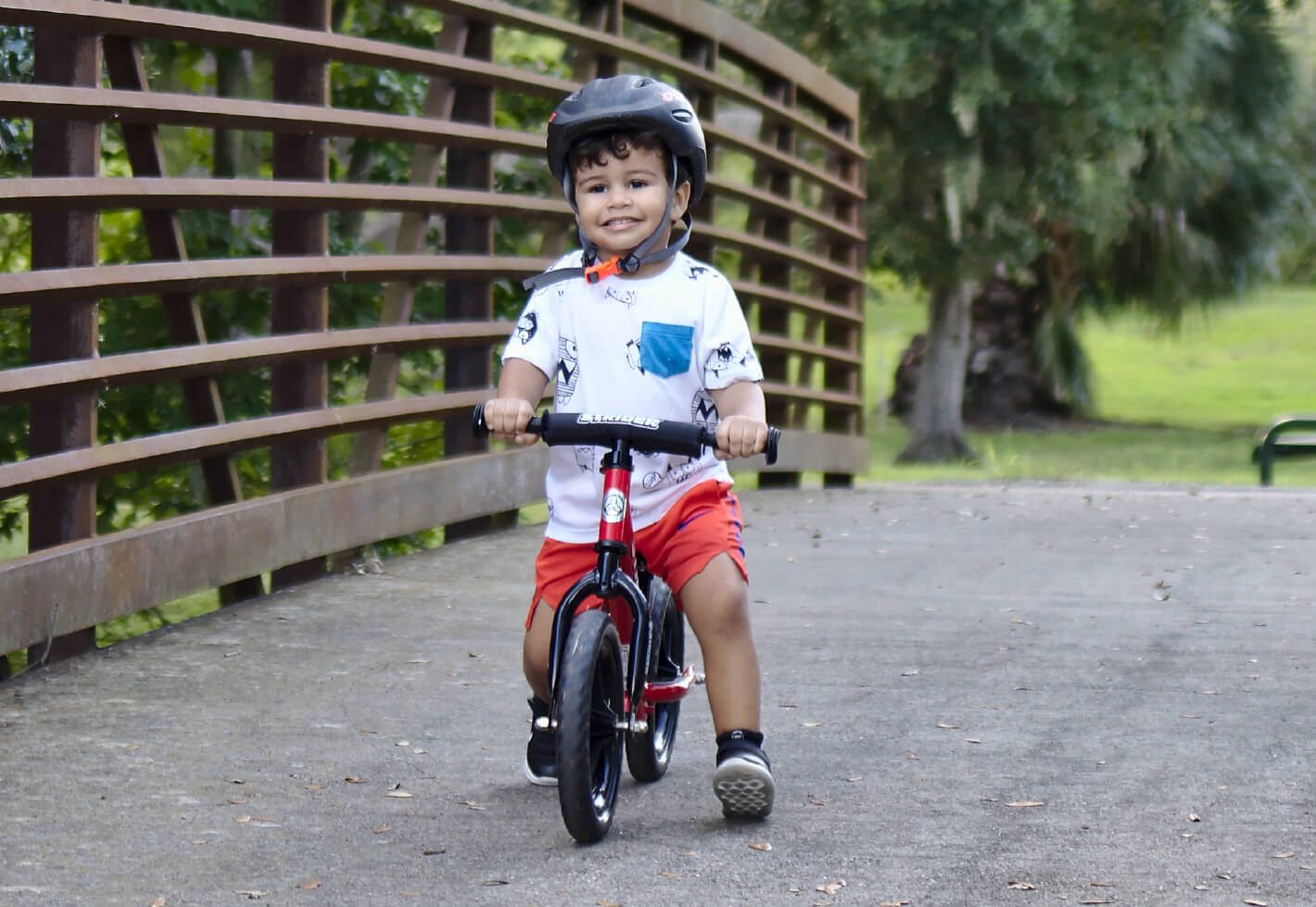 Child on a Strider 12 Balance Bike